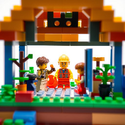 builder how build playground house with children in a simple realistic lego design with a white background