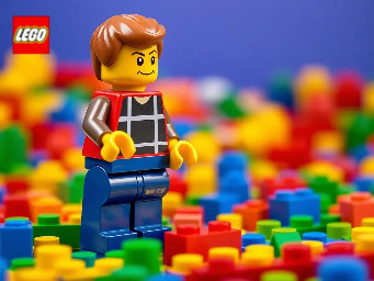 Create a lego image with the concept “Your imagination. your design. Your role” basically focusing on individualism (i.e. an individual standing and building with Lego block alone) with motivation “Your Lego”