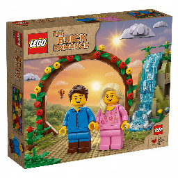 A premium, high-definition 8K product photograph of an official LEGO set box. The box art features a LEGO minifigure couple holding hands based on the reference photo, set against a beautiful brick-built background. Crisp packaging design with clear 'LEGO' style branding text in the corner, hyper-realistic cardboard texture, professional studio lighting.