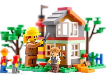 builder how build playground house with children in a simple realistic lego design with a white background