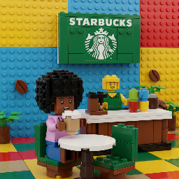 A brown coloured girl with black afro hair drinking latte at starbucks
