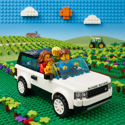 Mm and dad with toddler daughter and son in Range Rover in vineyard